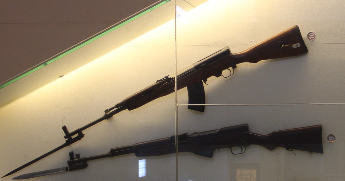 Figure 1 — A Type 63 above and a Chinese Type 56 SKS below in the Hanoi weapons museum, both left side, bayonets extended. The Type 63's detachable magazine ahead of the trigger guard is the difference that s…