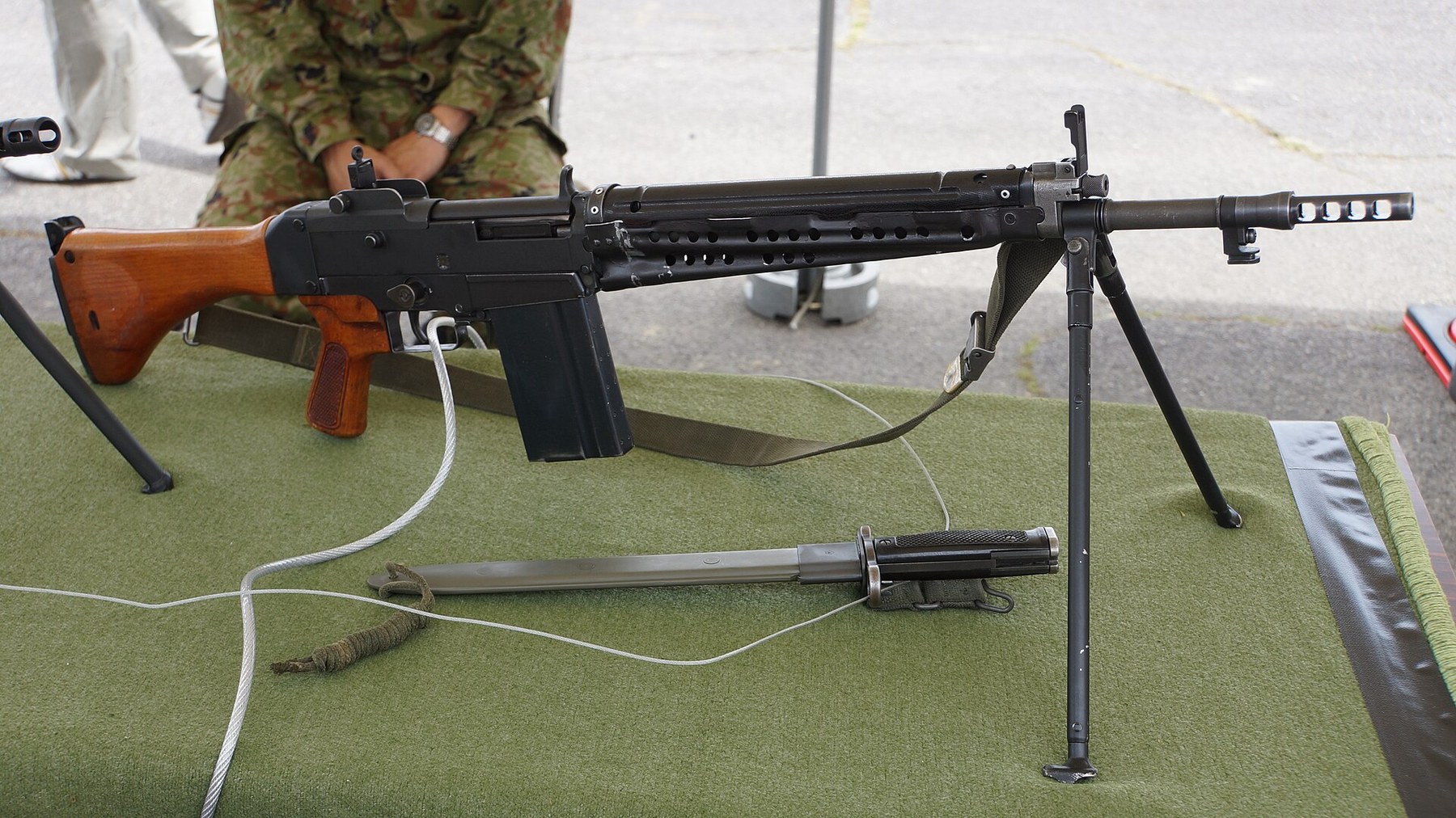 Figure 2 — A Type 64 with its bayonet, sheath and magazine on display at Camp Ōtsu, May 2016. Photograph by Hunini, CC BY-SA 4.0, via Wikimedia Commons.