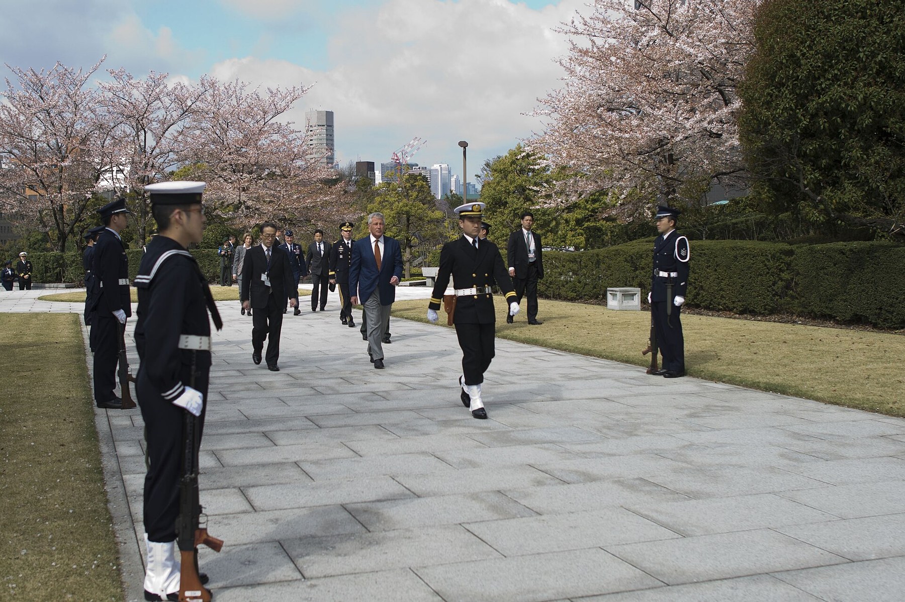 Figure 4 — A JMSDF honour guard with Type 64 rifles during US Secretary of Defense Chuck Hagel's visit to Tokyo, April 2014. US Department of Defense photograph by Erin A. Kirk-Cuomo, public domain, via Wikim…