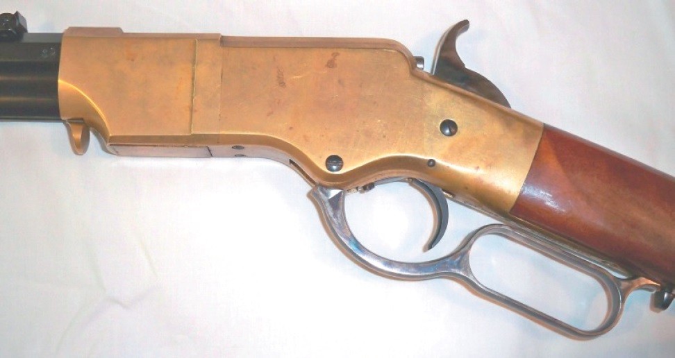 Figure 7 — The Henry rifle's action closed and opened, from the National Park Service's nineteenth-century repeaters manual. Opening the lever folds the toggle under the breech-pin and draws it back, exactly …
