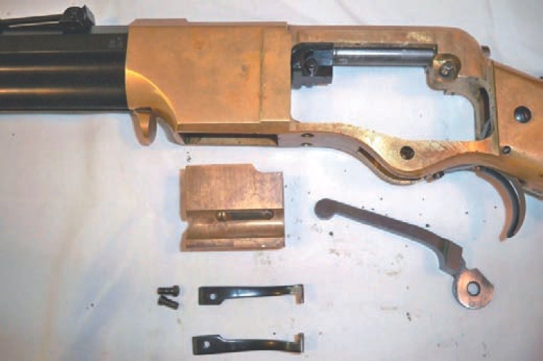 Figure 3 — The Henry's action parts removed from the frame: the carrier block, the toggle links, the lever and the breech-pin. Again a Henry, from the same NPS manual. Public domain.