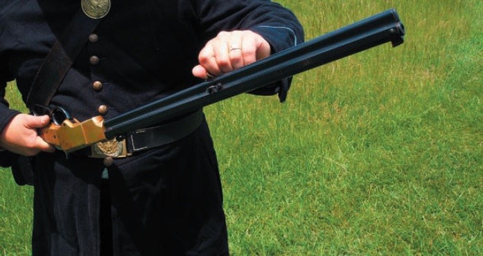 Figure 9 — Loading a Henry, step 1, from the NPS manual: the follower, called the plunger, is pushed up to the muzzle end of the magazine. This is the Volcanic's first step too. Public domain.