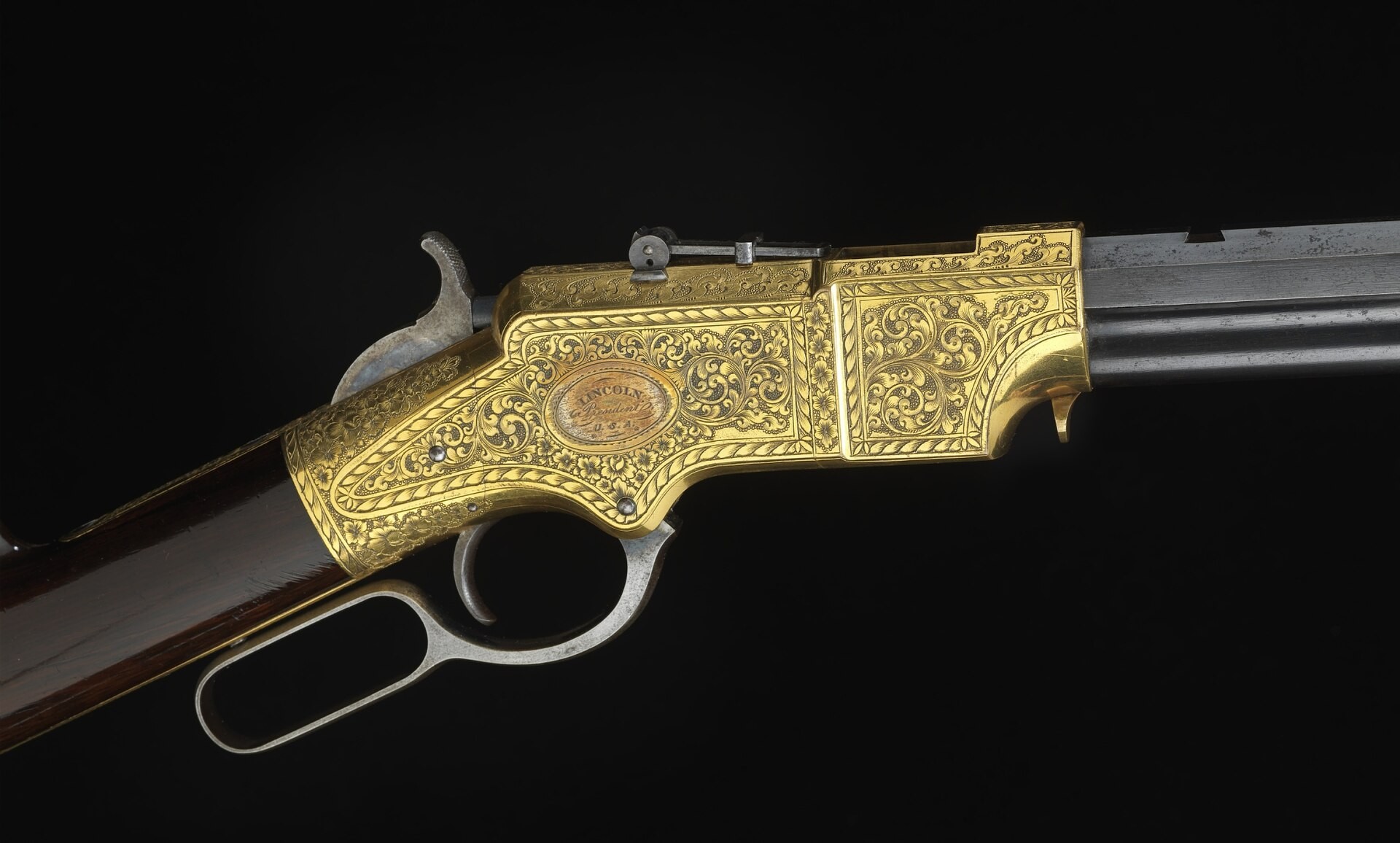 Figure 16 — A Henry with an engraved frame in the National Museum of American History, filed on Wikimedia Commons in the category for the Henry rifle presented to Abraham Lincoln; the museum's caption calls it…