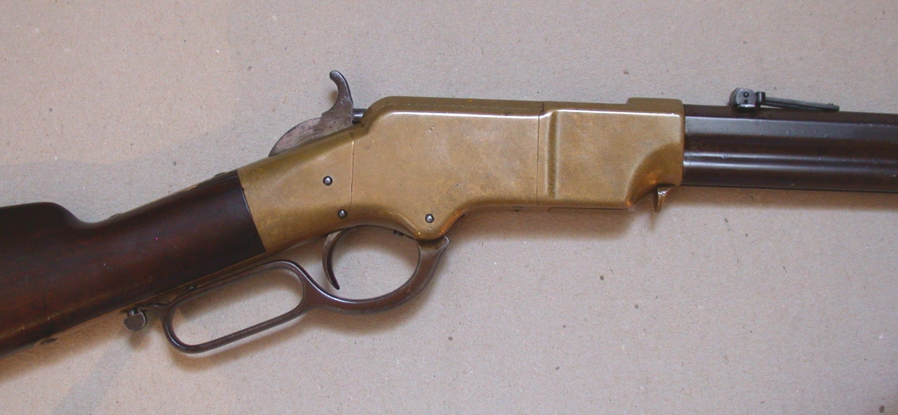 Figure 15 — A Henry rifle's brass frame, closed, with its lever and hammer. Compare the frame with the Volcanic carbine's in Volume 4: the same outline, longer and deeper to take the .44 cartridge. Photograph …