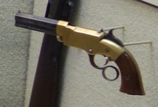 Figure 7 — A brass-framed short Volcanic-type pistol on display in the Huntington Museum of Art, West Virginia, in the case "Men Who Made the Gun". The short barrel and brass frame fit a New Haven Arms No. 1 …