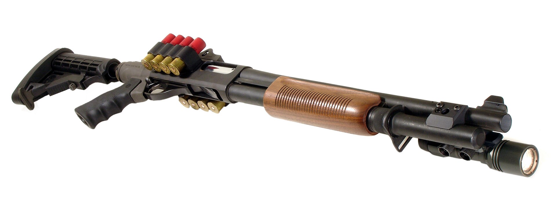 Figure 2 — An 870 with a collapsible AR-pattern stock and pistol-grip adapter, a light on the magazine, and shell carriers on the side of the receiver. The in-line stock is the configuration the ATI T3 gives …