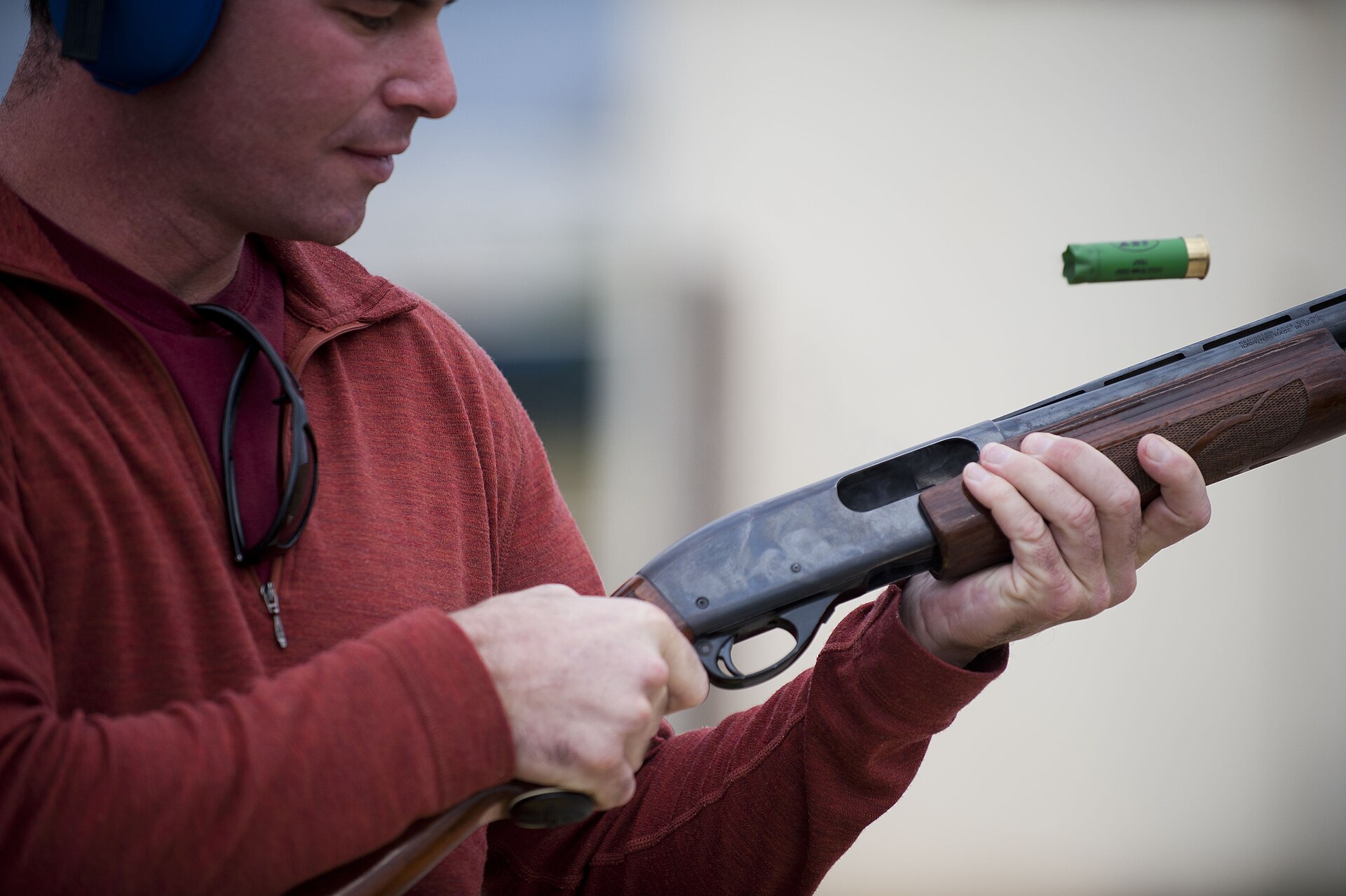 Figure 4 — An Air Force officer working the action of an 870 at a turkey shoot in Turkey in 2012, with the fired hull leaving the ejection port. On a pump, how hard and how completely the fore-end is worked d…