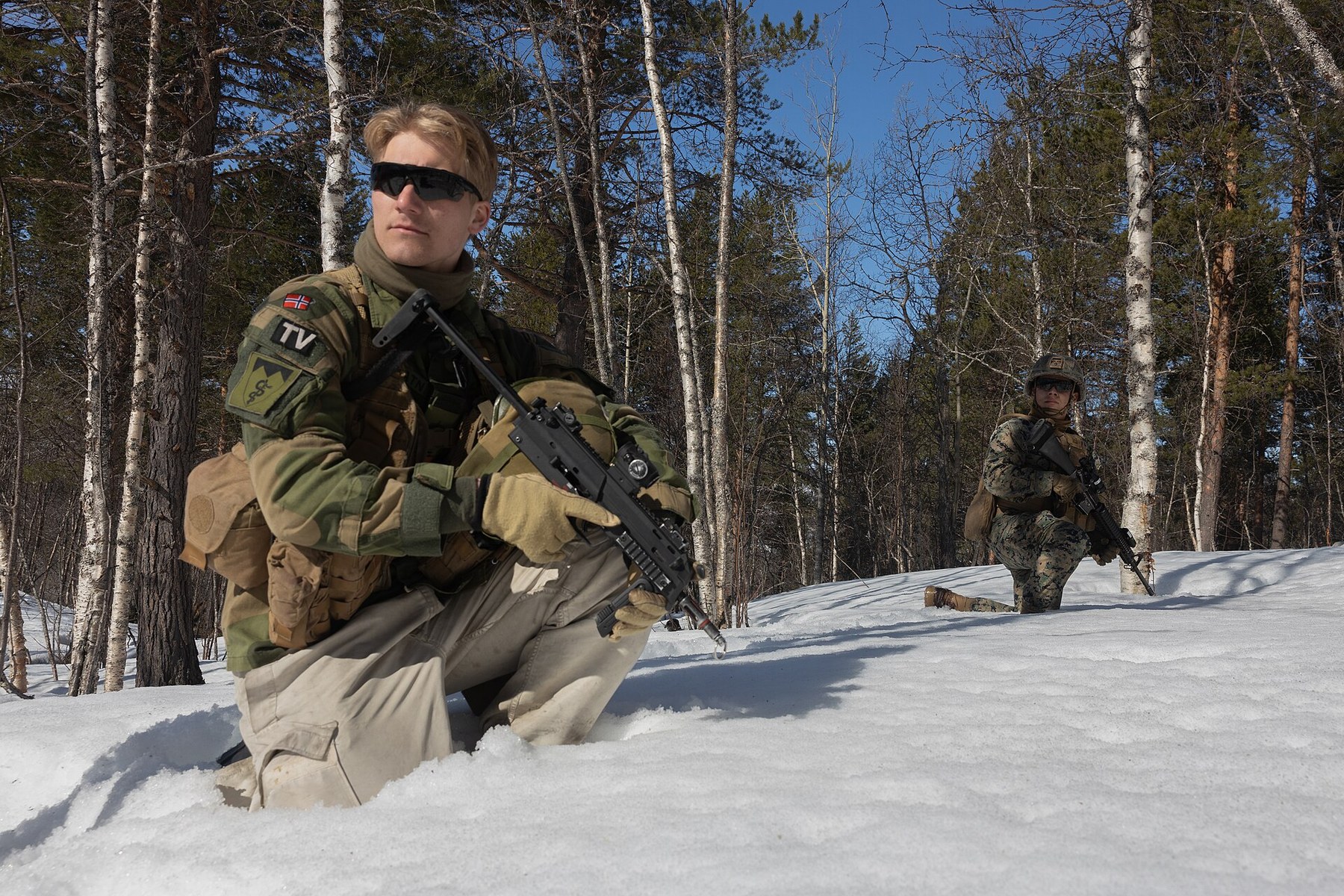 Figure 8 — Norwegian soldiers on a simulated patrol with US Marines during exercise Swift Response 25 at Setermoen, Norway, in May 2025. The soldier in the foreground carries an MP7.