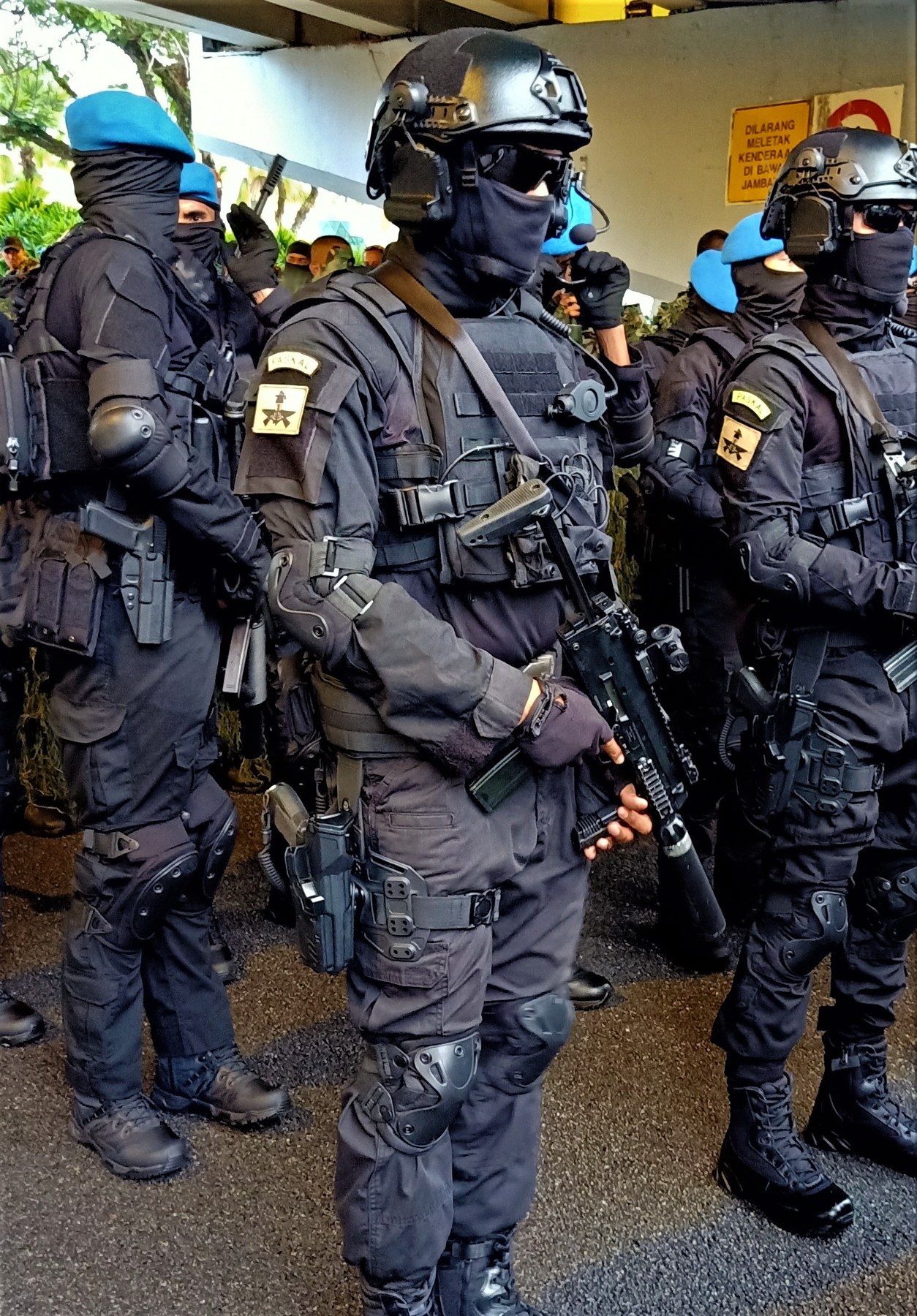 Figure 12 — Operatives of PASKAL, the Royal Malaysian Navy's special forces, at the 65th Merdeka Day parade in Kuala Lumpur in 2022. The photographer identifies their weapons as MP7A1s; the suppressed MP7 is v…