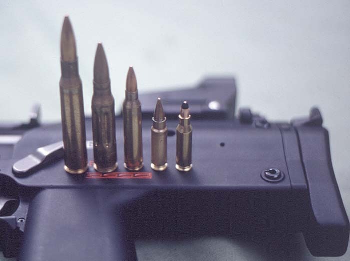 Figure 5 — The 4.6×30 against larger rounds, photographed on a PDW in 2001. Small Arms Review's caption, read from right to left: the 4.6×30, the FN 5.7×28, the 5.56×45 NATO, the 7.62×51 NATO and the .30-cali…