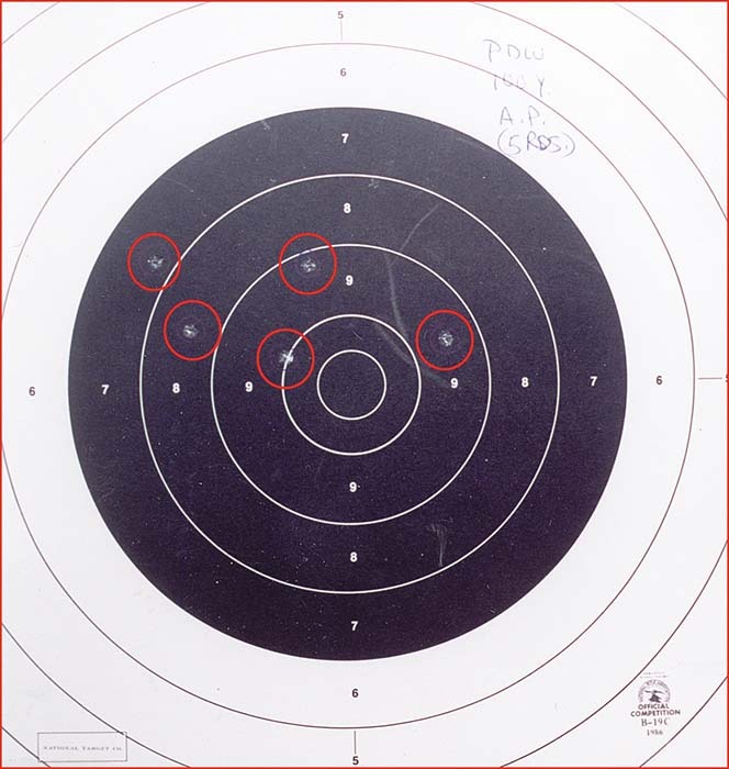 Figure 4 — The PDW prototype's 100-yard group from Small Arms Review, April 2001: five shots, circled, in "not quite 5 inches", fired prone with the Hensoldt reflex sight. The handwritten note reads "PDW" and…