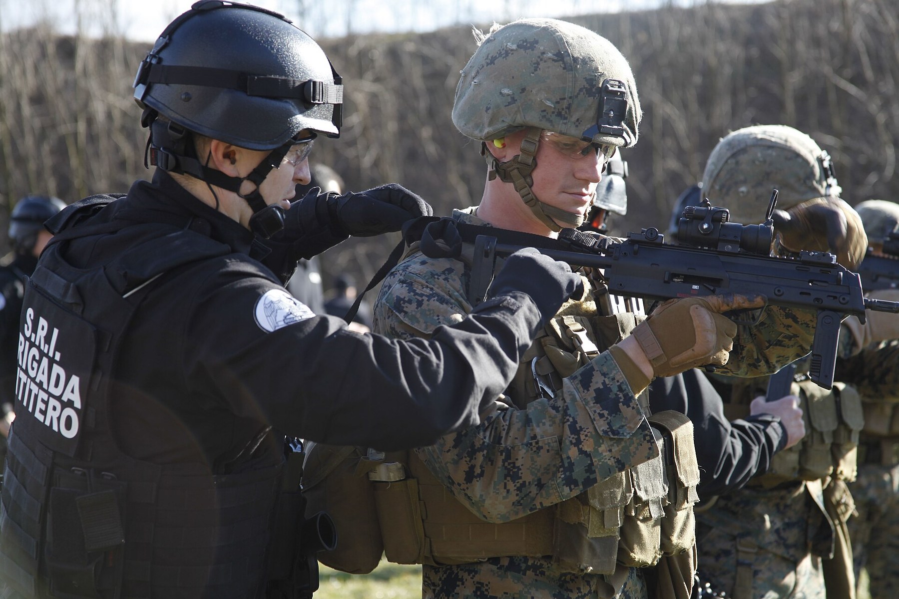 Figure 9 — A US Marine of Fleet Anti-terrorism Security Team Company Europe receiving instruction on the MP7 from a member of the Romanian intelligence service's counter-terrorist brigade, Bucharest, February…