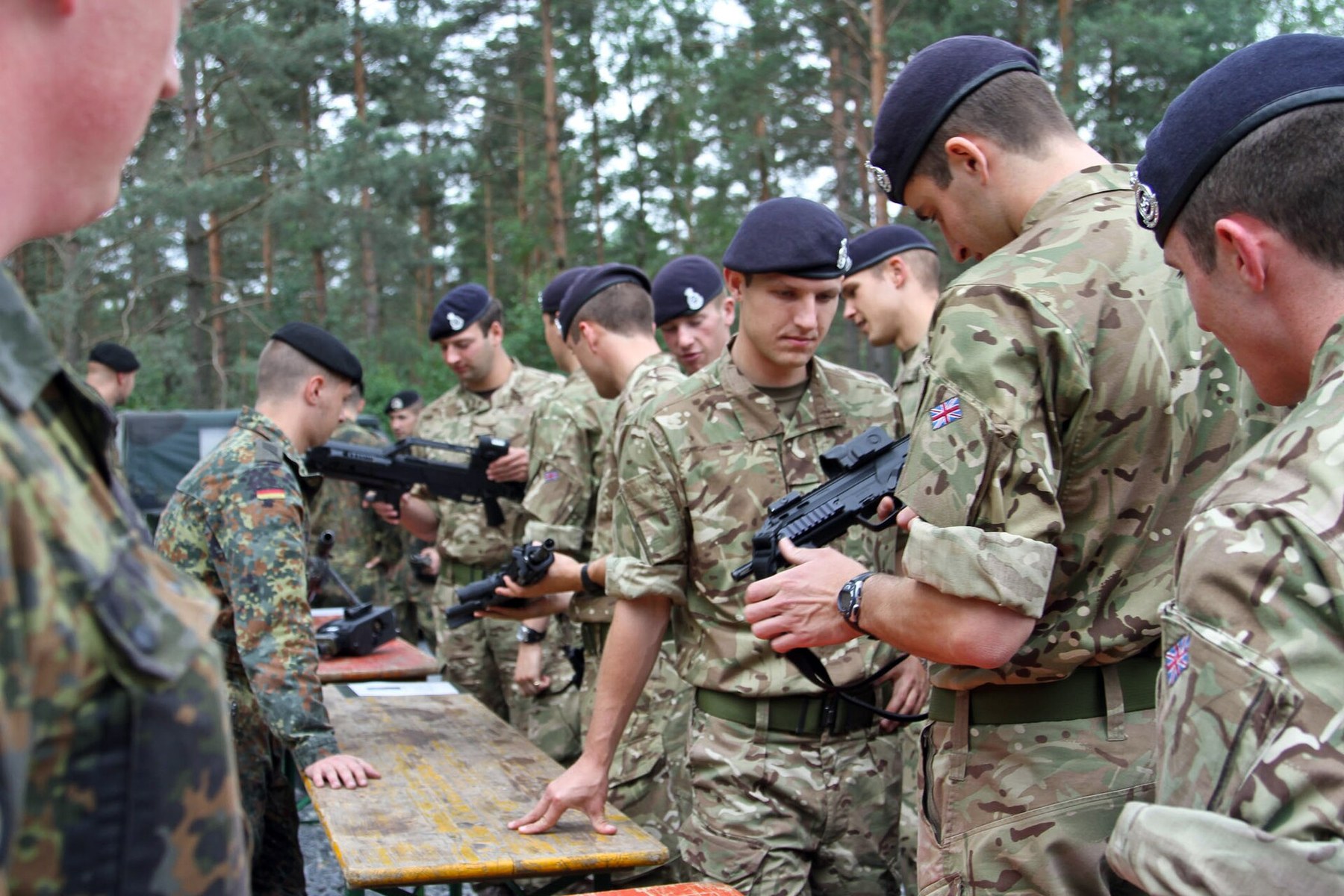 Figure 3 — Royal Military Academy Sandhurst cadets handling German weapons at a display of US and German equipment at Grafenwöhr, July 2014. The cadet on the right holds an MP7.