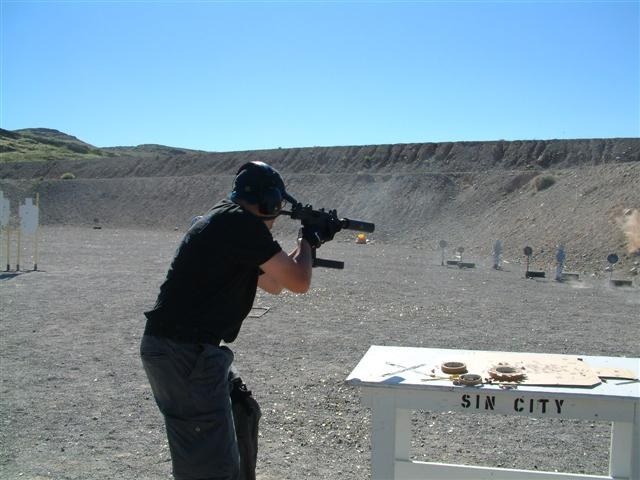 Figure 13 — A Mini-Uzi in use at a submachine-gun match in 2005; its uploader identifies it as a Vector Arms Mini-Uzi, fitted with a suppressor. Photograph by I'mTodd, CC BY-SA 3.0, via Wikimedia Commons.