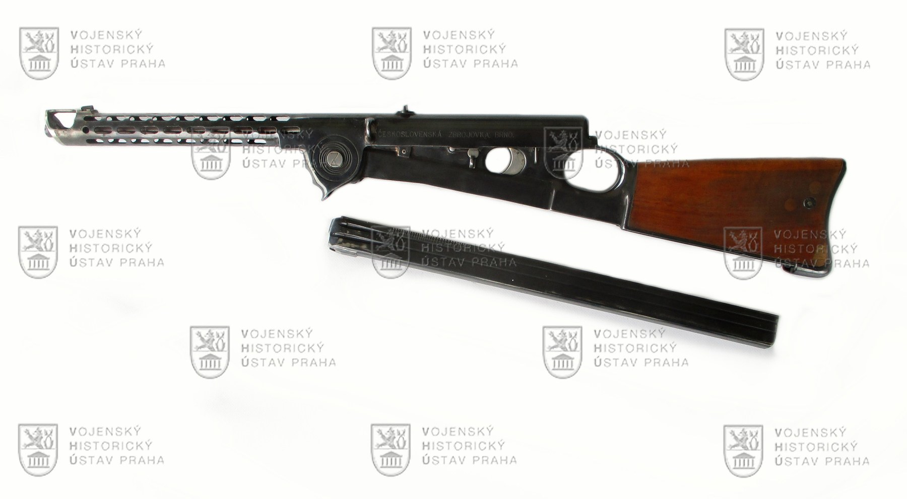 Figure 4 — The ZB 46 opened, with its magazine out: the receiver tipped up on the front pivot, and the long box magazine. Photograph © VHU Praha.