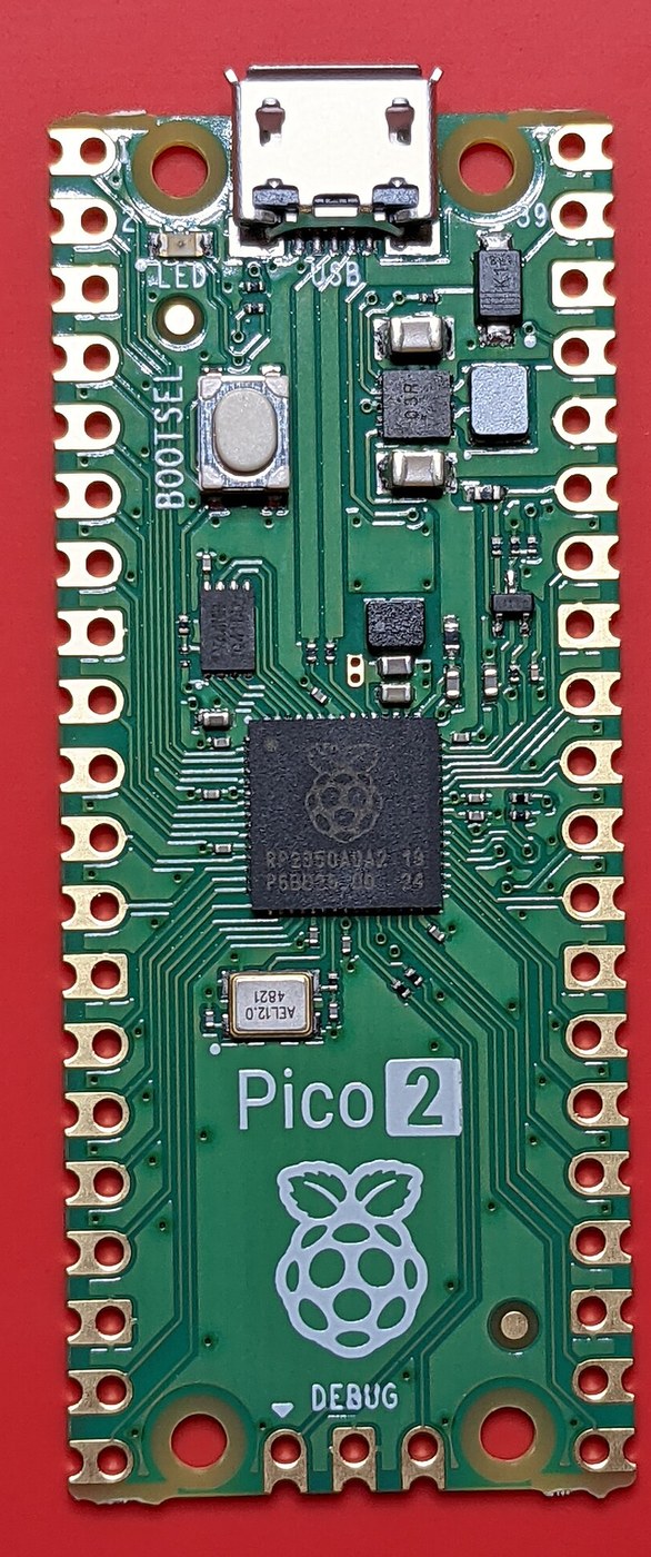 Figure 3 — The Raspberry Pi Pico 2, the RP2350 version of the board. It is pin-for-pin compatible with the original Pico, and OpenFIRE uses the same default layout for both. Photo: Profpcde, Wikimedia Commons…