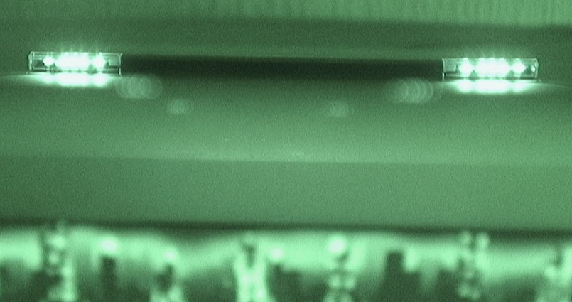Figure 1 — A Nintendo Wii sensor bar photographed with a camera in night-shot (infrared-sensitive) mode. The bar's two infrared clusters, one at each end, glow brightly; to the eye they are dark. A DIY light-…