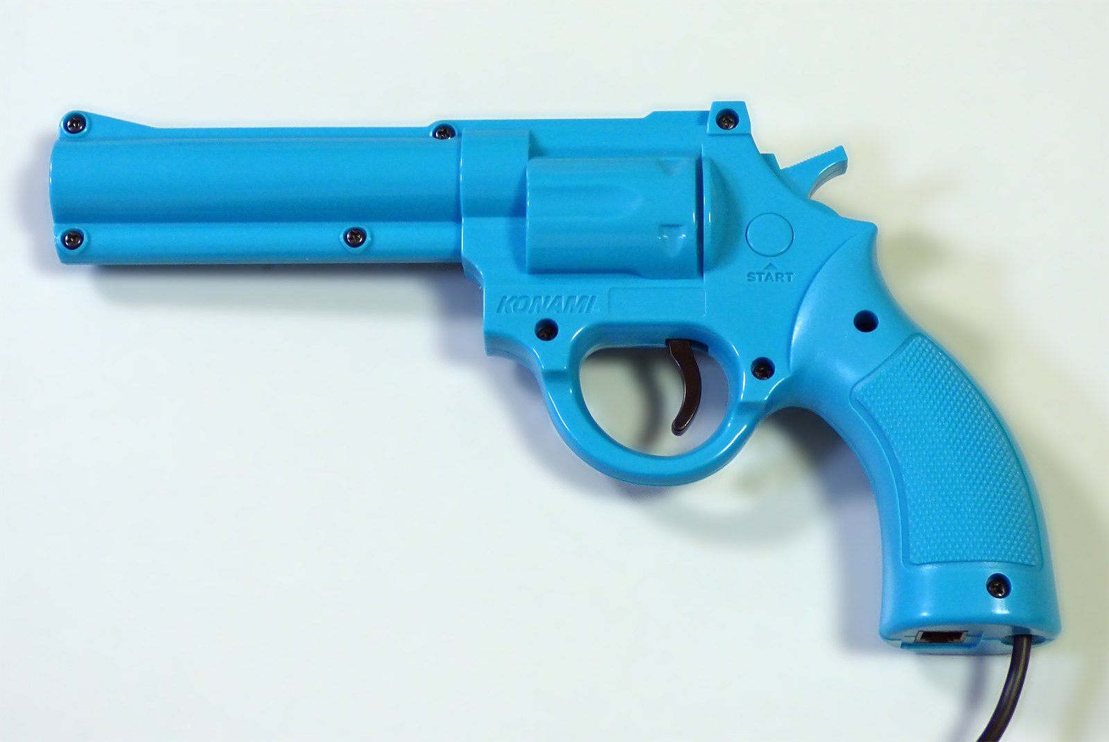 Figure 8 — A blue Justifier sold for the Super Famicom, photographed by its owner in Japan. The player-1 guns for the two consoles share the revolver mould; the plug at the end of the cable is what tells them…