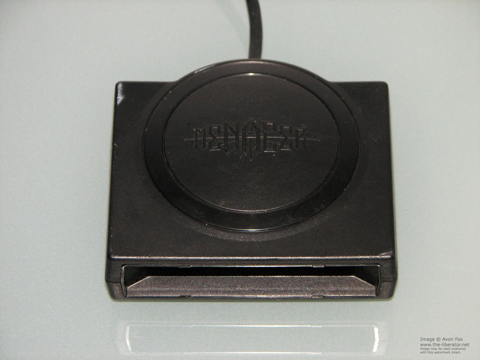 Figure 6 — The Menacer's receiver, which sits on top of the television and connects to the Mega Drive's second controller port. Like the Super Scope's, it is easily separated from the gun in a sale. Photo: th…
