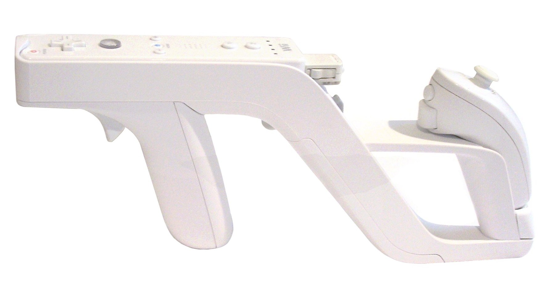 Figure 2 — The Wii Zapper with a Wii Remote fitted in the front and a Nunchuk in the rear grip. The Zapper is a plastic shell with no electronics: the Wii Remote's camera does the aiming, and the trigger pres…