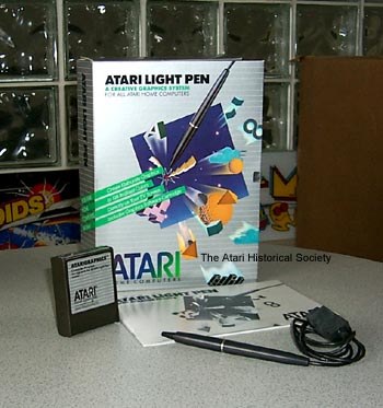 Figure 3 — The Atari Light Pen in its box with the AtariGraphics cartridge, the pen on its cord and the manual. Photo: Atari Historical Society display, via the Atari Museum, atarimuseum.ctrl-alt-rees.com.