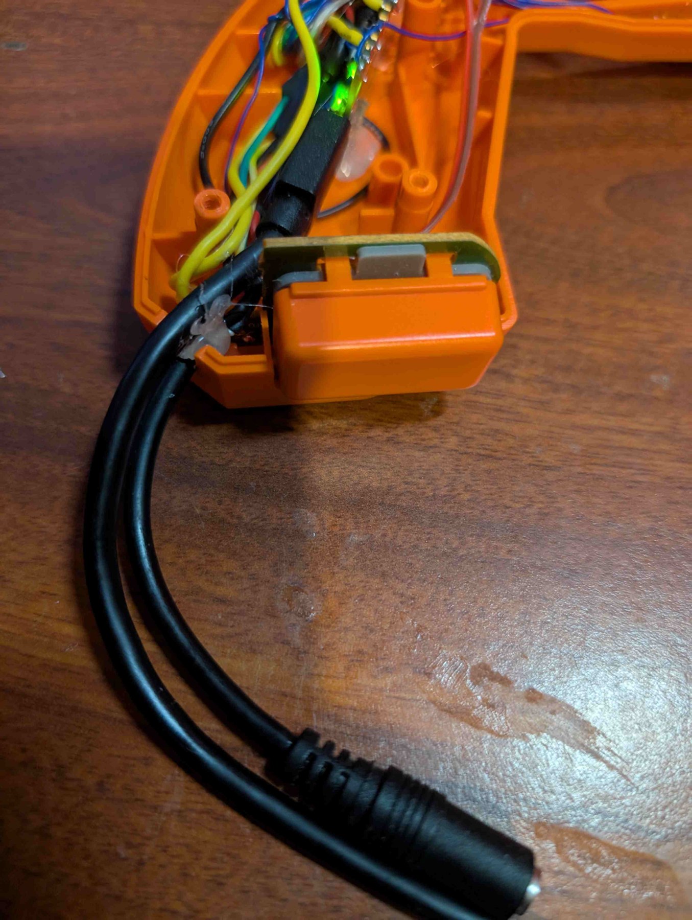 Figure 7 — The original cable outlet carrying the USB lead and a short female 3.5 mm lead for the foot pedal. Photo: The Opponent, 28 July 2025, CC0.