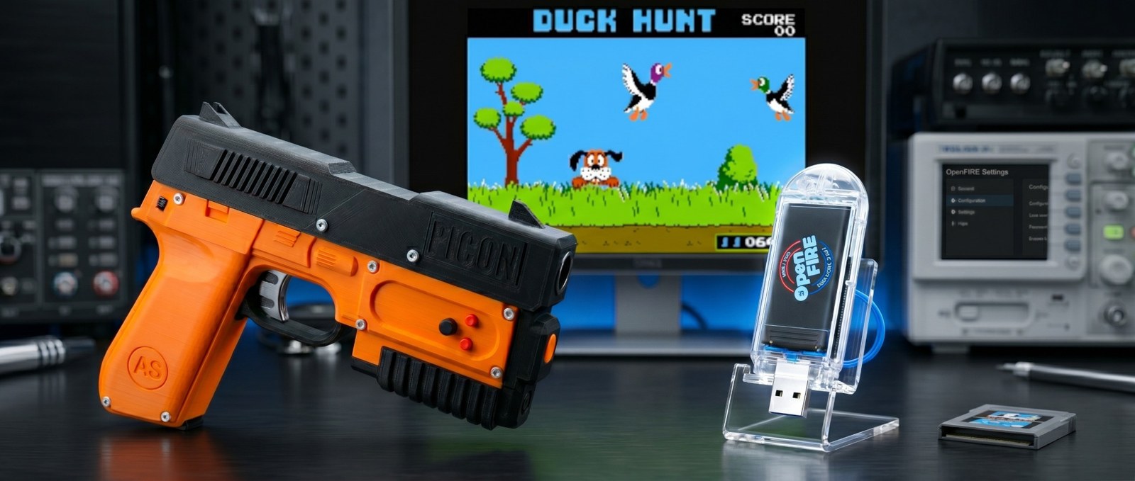 Figure 2 — The OpenFIRE ESP32 port's cover image: the PICON-AS printed light gun beside an ESP32-S3 USB dongle in a clear case with an OpenFIRE label, in front of a monitor showing Duck Hunt. It is a promotio…