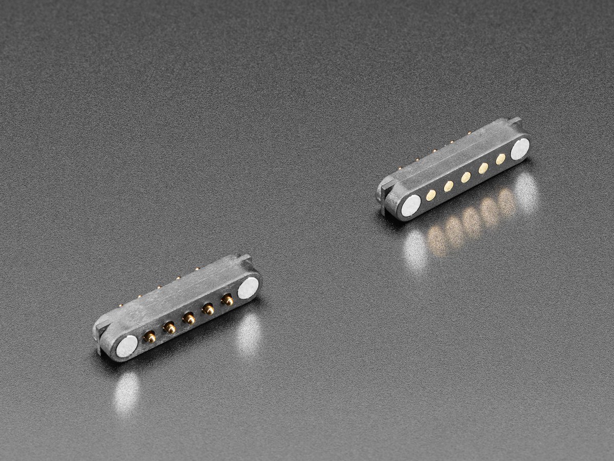 Figure 6 — Adafruit's DIY magnetic connector, five spring pins on a 0.1 inch pitch with a magnet at each end, sold as a matched pair. Useful for trying a breakaway on the bench; the product page gives no curr…