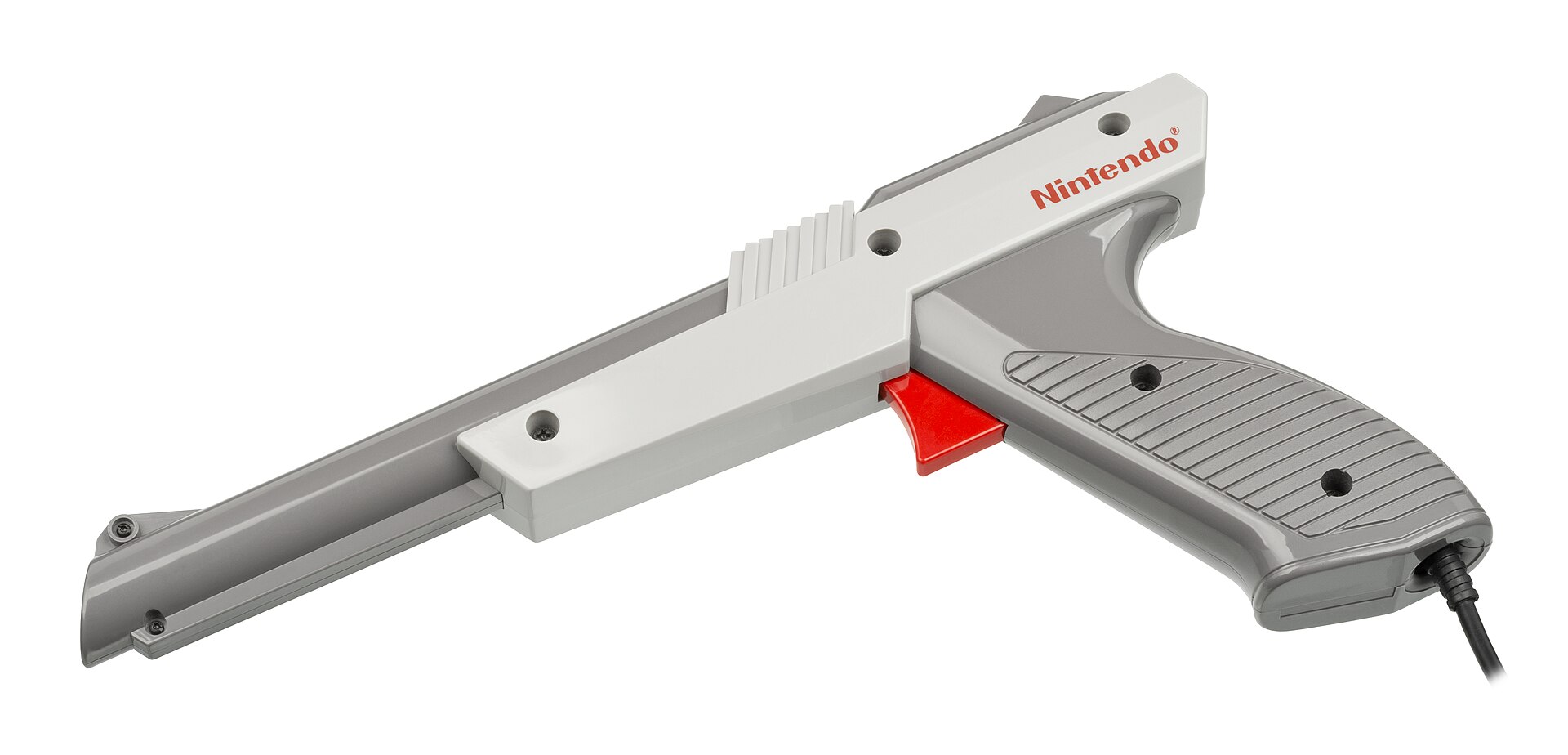 Figure 2 — The grey NES Zapper. Its barrel holds the light sensor; its circuit board carries a Sharp IR3T07A filter chip. It reports only a trigger bit and a light bit, and knows nothing about the screen's ti…
