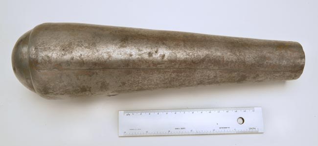 Figure 8 — The flask of the Beeman rifle: a tapering iron cone with a rounded end; the rivet marks along its seam are visible on close inspection. Photograph by Robert D. Beeman, 2005, from beemans.net via th…