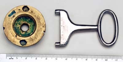 Figure 10 — The magazine cap of the Beeman rifle and the key used to turn it. Photograph by Robert D. Beeman, from beemans.net via the Internet Archive.