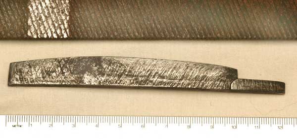 Figure 5 — Underside of the Beeman rifle's mainspring (below), with a farrier's file ground down by Ernest Cowan (above) to show the double-cut diamond pattern that Cowan found almost filed away on the spring…