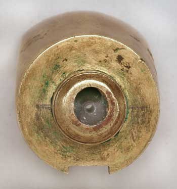 Figure 5 — The rear face of the Beeman rifle's receiver, where the flask screws on: the striker pin's steel sleeve in the centre and, above it, the bean-shaped mouth of the air passage, drilled and filed into…