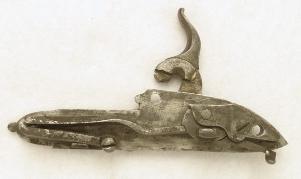 Figure 5 — The inside of the lock of a Contriner Girandoni-system rifle in the Beeman collection, showing a V-shaped mainspring, where the military rifle has a long flat spring. Photograph by Robert D. Beeman…
