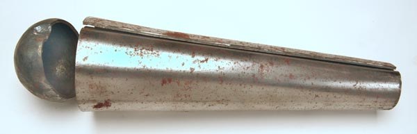 Figure 4 — The cap and the shaped iron sheet for a Cowan copy flask before assembly. Photograph by Robert D. Beeman, 2005, from beemans.net via the Internet Archive.