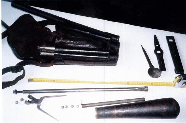 Figure 9 — The Girandoni accoutrement pouch in the Museo Nazionale Storico d'Artiglieria, Turin, which Beeman describes as the only original known, with its contents laid out: the long pump and its tool-handl…